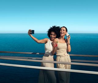 Two friends take a selfie with a smartphone against the sea backdrop | MSC Cruises