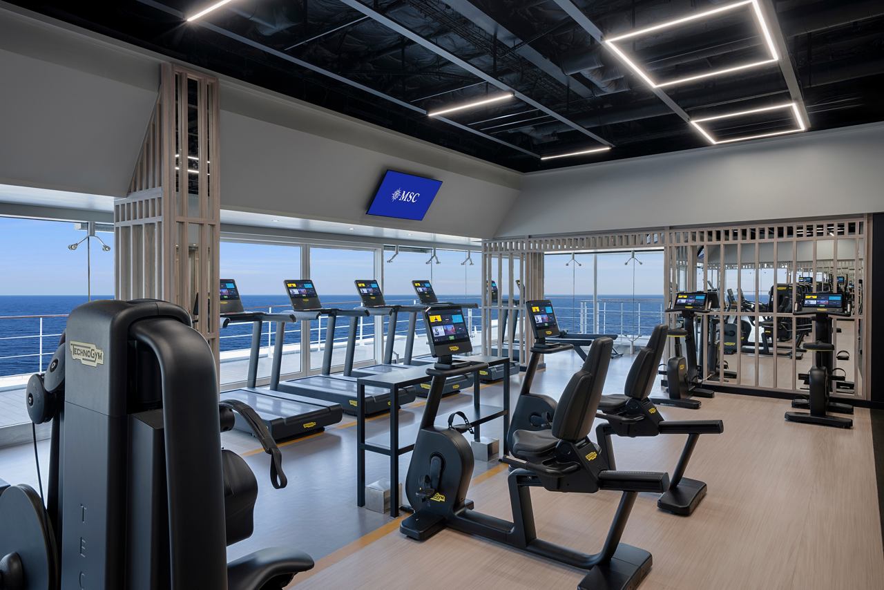 Modern gym with equipment and a sea view | MSC Cruises