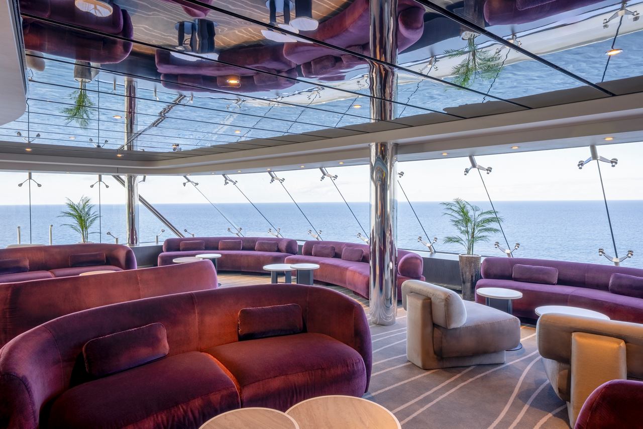Lounge with comfortable sofas and sea views in MSC Yacht Club | MSC Cruises