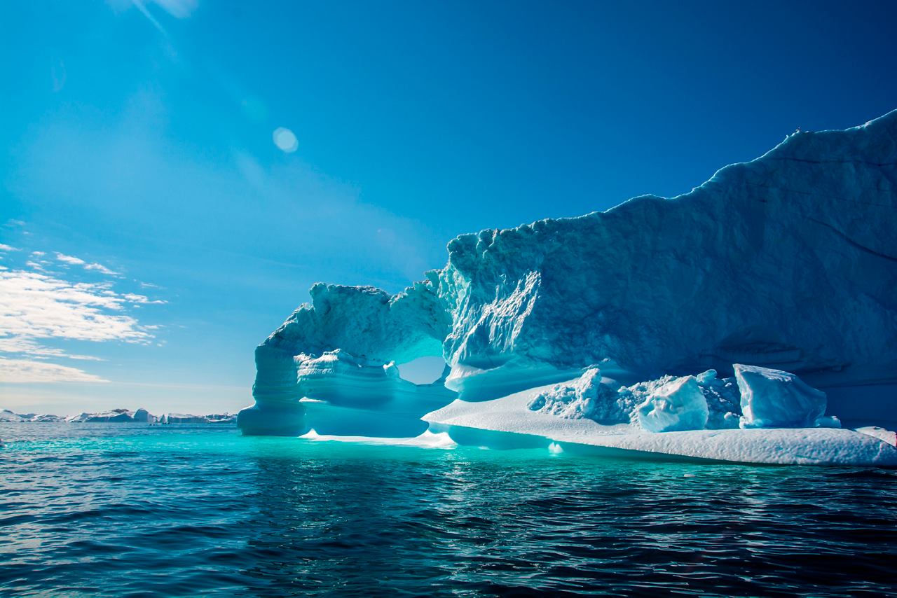 An iceberg in Ilulissat, Greenland, reflects the beautiful blue tones of the sea | MSC Cruises