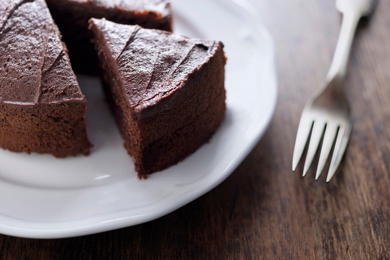 Chocolate cake sliced into pieces, served with a fork | MSC Cruises