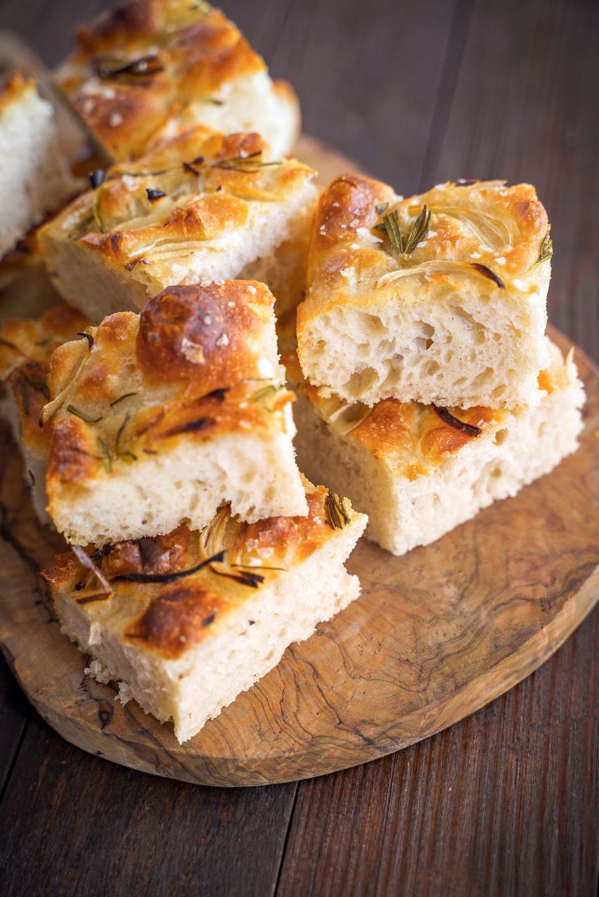 Juicy pieces of focaccia served on a wooden board | MSC Cruises