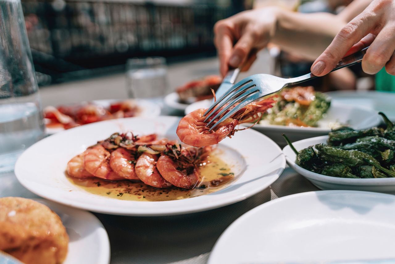 Close-up of a shrimp dish with a fork and knife, ready to be served | MSC Cruises
