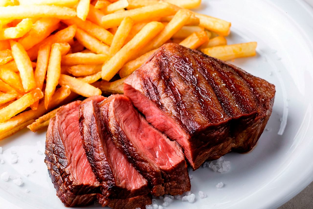 Juicy steak with fries served for welcome lunch on board | MSC Cruises