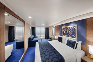 Cozy cabin with a double bed and balcony offering comfort and style | MSC Cruises