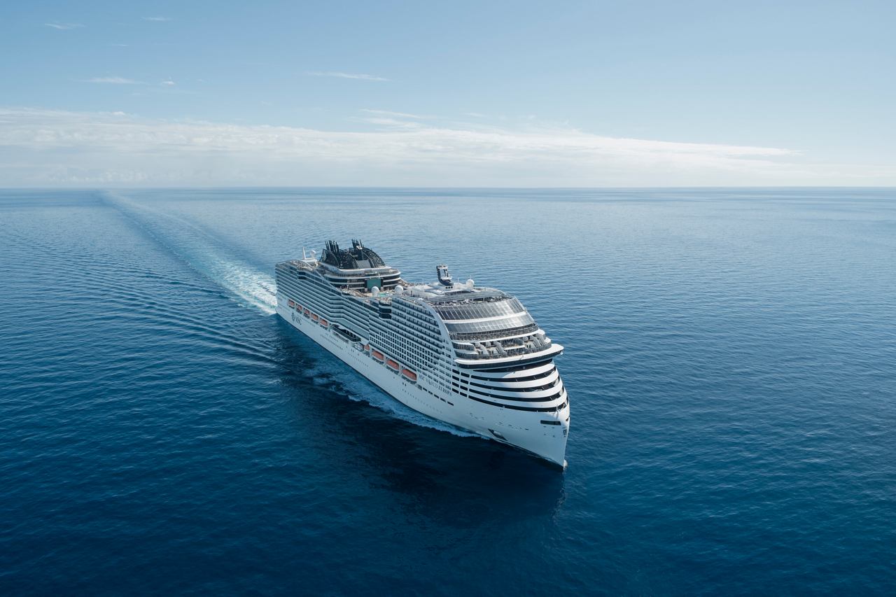 Aerial view of MSC World Europa ship sailing on the sea under clear sky | MSC Cruises