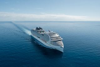 Aerial view of MSC World Europa ship sailing on the sea under clear sky | MSC Cruises