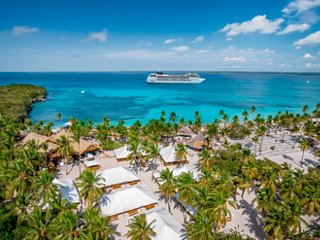 Aerial view of beach with palms and MSC Poesia ship near Catalina Island, Dominican Republic | MSC Cruises