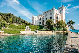 Miramare Castle in Trieste by the Mediterranean Sea under a clear blue sky | MSC Cruises