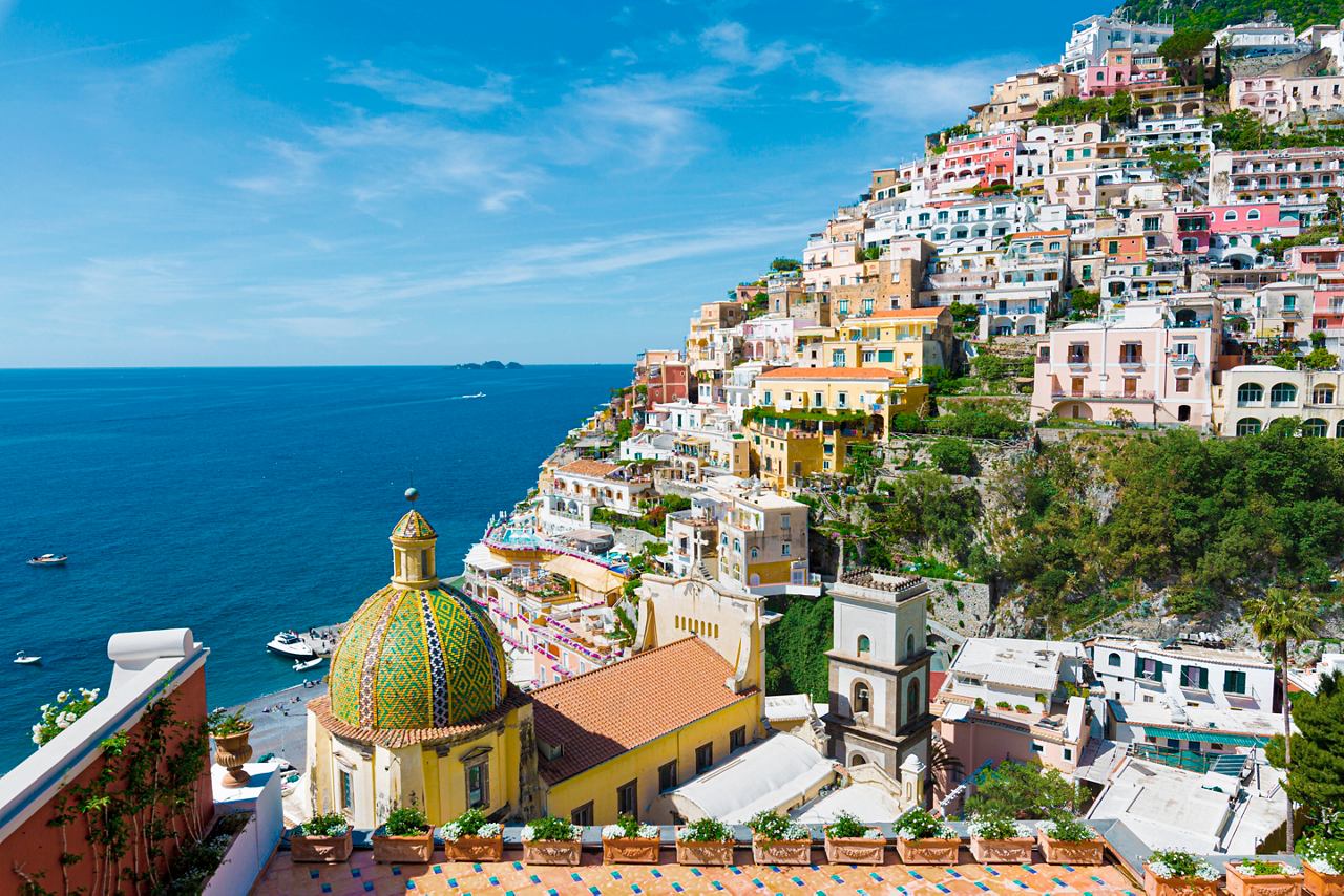Coastal town with colorful buildings on a hill by the Mediterranean Sea in Positano, Italy | MSC Cruises