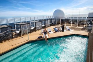 Deck pool with sun loungers and attentive crew service at MSC Yacht Club | MSC Cruises