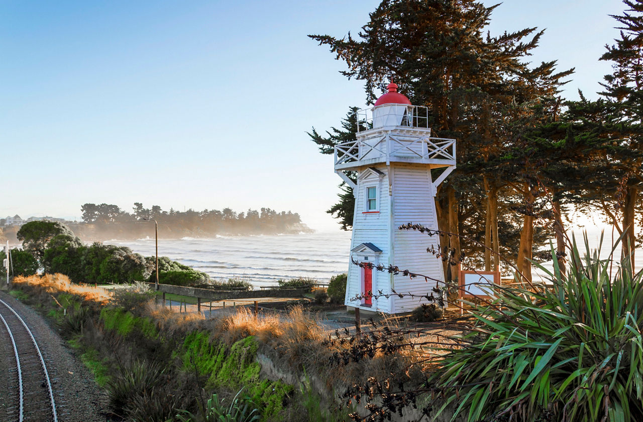 Lighthouse by the sea with lush greenery in Timaru, New Zealand | MSC Cruises