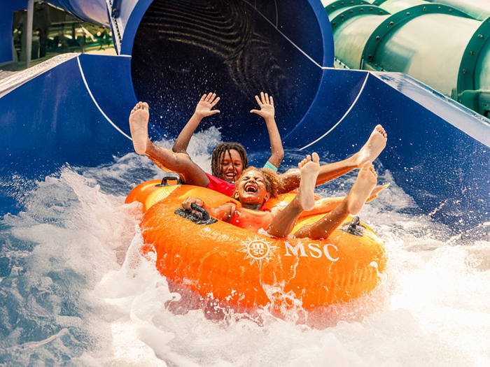 Children ride an exciting waterslide in the onboard entertainment park | MSC Cruises