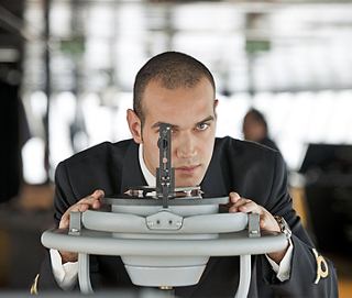 Crew officer on deck wearing white uniform | MSC Cruises