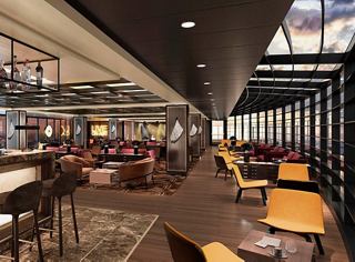 Área de descanso moderna con muebles cómodos y vistas impresionantes al mar | MSC Cruceros