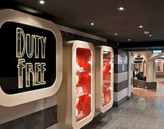 A shopping area featuring vibrant displays and signage inviting guests to explore duty-free options | MSC Cruises
