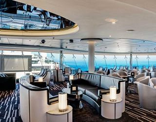 A stylish lounge with comfortable seating and panoramic ocean views, perfect for relaxation and socialising | MSC Cruises
