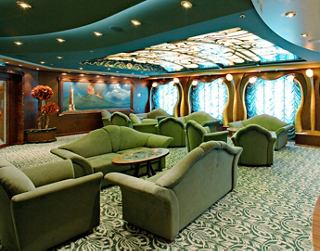 A spacious lounge area with comfortable seating and large windows, perfect for relaxation and socialising | MSC Cruises
