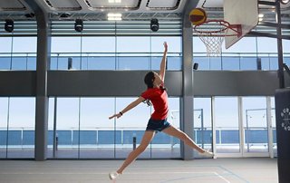 Athlete leaps to make a basket, inspiring an active lifestyle | MSC Cruises