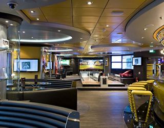 A lively sports bar setting with modern decor and multiple screens for enjoying games and events | MSC Cruises