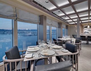 Modern restaurant featuring panoramic ocean views and a cozy atmosphere | MSC Cruises