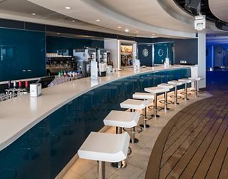 Modern bar with comfortable seating and stylish decor, ideal for socializing | MSC Cruises