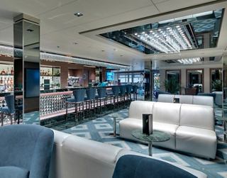 The modern bar offers a cozy atmosphere for enjoying drinks and good company | MSC Cruises