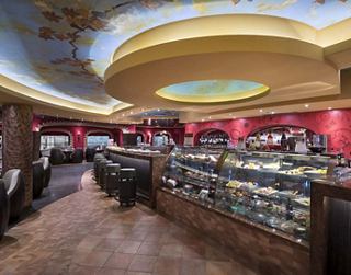 A welcoming interior of the Tea House Dim Sum restaurant, featuring elegant decor and a variety of seating options | MSC Cruises