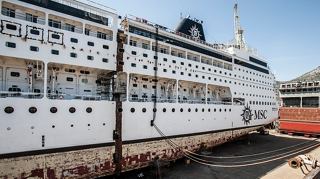 A majestic cruise ship docked at the harbour, symbolising adventure and exploration | MSC Cruises