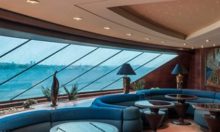 Luxurious lounge with panoramic windows overlooking the sea | MSC Cruises