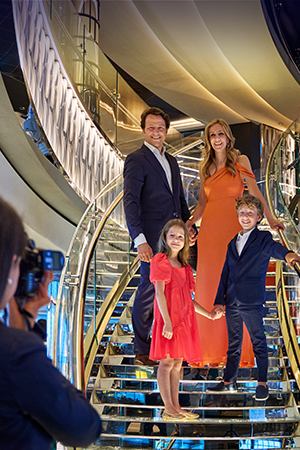Happy family on cruise ship looking out at the sea | MSC Cruises