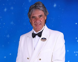 MSC crew officer with name badge and formal expression | MSC Cruises